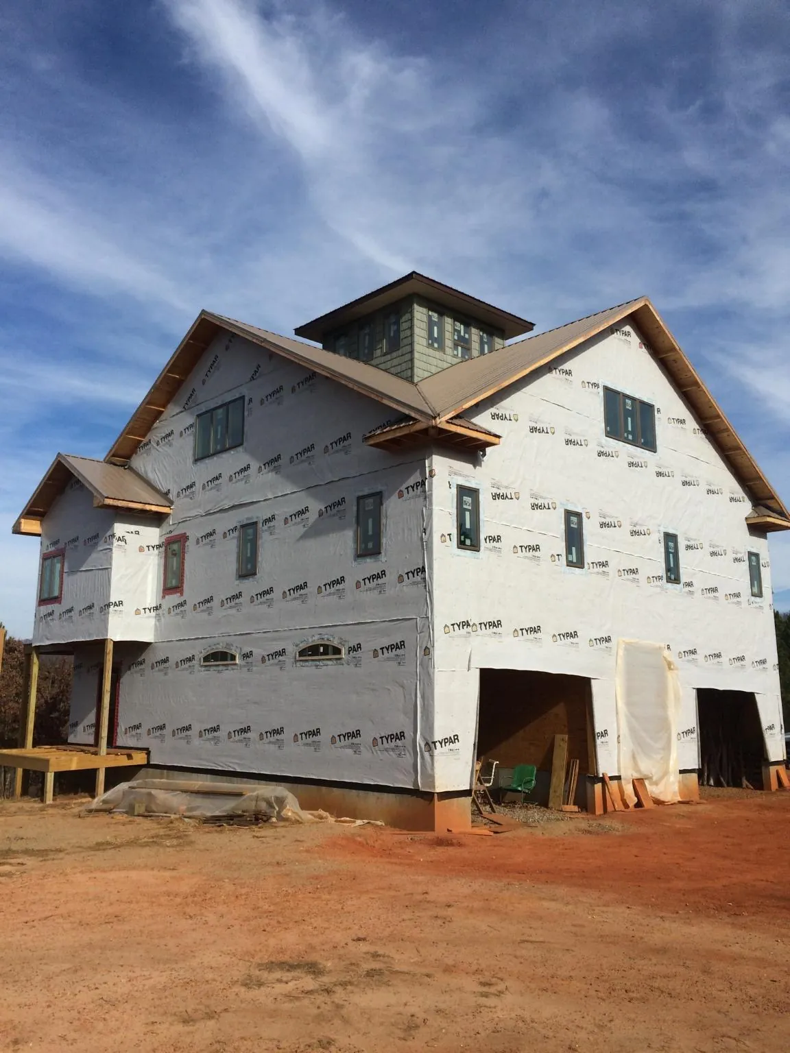 New two story house under construction with a cupola and gabled roofs in Clearfield